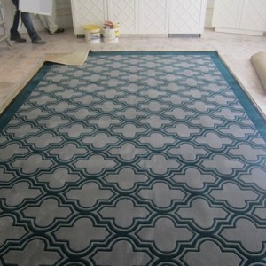 This is what happens when a designer orders the hand made rugs from the plans,without remeasuring on site, only 100mm short for both rooms